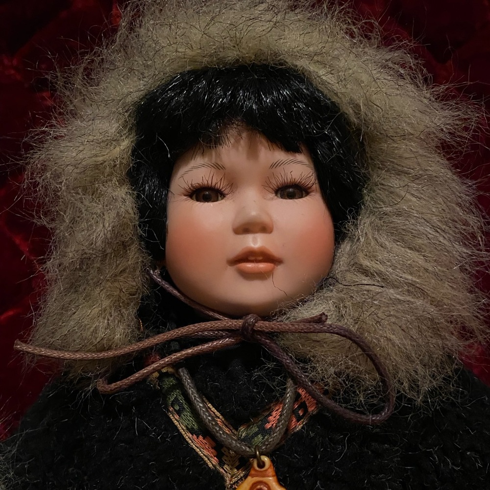 Adorable Alaskan Porcelain doll w fishbone necklace